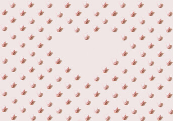 Rectangular shape isometric pattern created of heart marshmallows in pink and white color with heart shaped copy space in the middle. 45 degree angle on pastel beige color background.