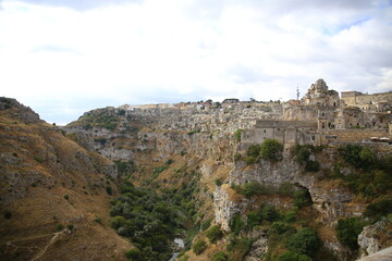 Fototapeta na wymiar View of the church of San Pietro Caveoso and the valley carved by the Gravina stream, Matera, European Capital of Culture 2019