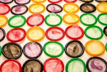 Colorful condoms background.