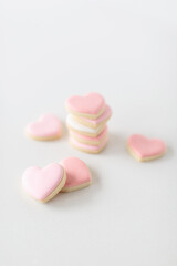 pink heart sugar cookies on white background, soft focus, shallow depth of field
