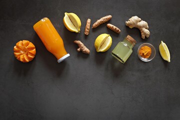 Pure vegan Immunity system booster. Ginger shot with citrus fruits juice and turmeric. Flat layot,...