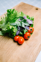vegetables on an oak cutting board in the kitchen