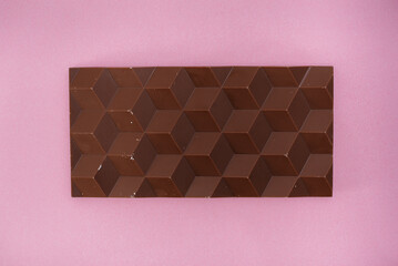 Natural handmade chocolate close-up on a bright background.