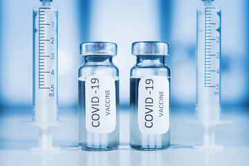 COVID-19 coronavirus vaccine. Ampoule and syringe close-up. Concept
