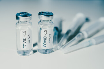 COVID-19 coronavirus vaccine. Ampoule and syringe close-up. Concept