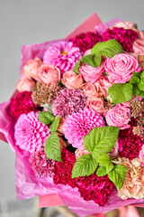 Red tones Beautiful bouquet of mixed flowers. the work of the florist at a flower shop. Handsome fresh bouquet. Flowers delivery