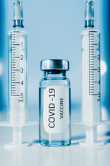 COVID-19 coronavirus vaccine. Ampoule and syringe close-up. Concept