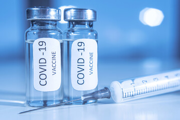 Vaccination against coronavirus COVID-19. Ampoule and syringe close-up. Concept
