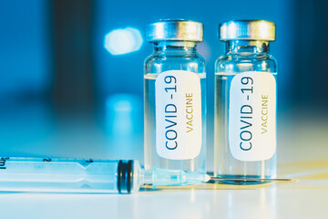 COVID-19 coronavirus vaccine. Ampoule and syringe close-up. Concept
