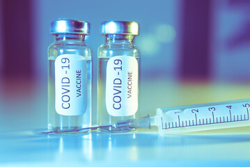 COVID-19 coronavirus vaccine. Ampoule and syringe close-up. Concept