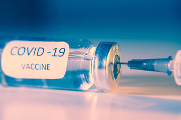 Vaccination against coronavirus COVID-19. Ampoule and syringe close-up. Concept