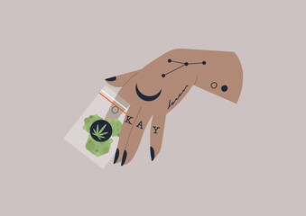 A tattooed hand holding a zip lock bag of cannabis, recreational drugs, legalised medicine