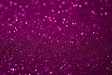 Texture of purple sparkles, close up, bright colorful texture, selective artistic focus