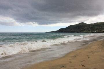 Breaking wave, light sand, Azores, Santa Maria island.