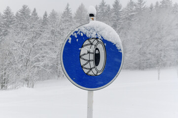 road sign snow chains, Winter in Krkonose mountains, Czech Republic pure white snow,