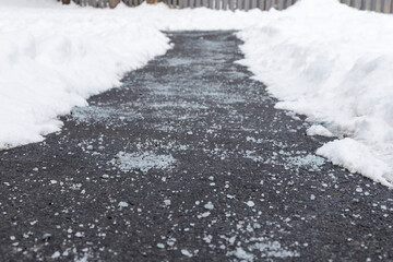 Winter road with salt for melting snow