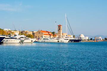 Fototapeta na wymiar Mandraki harbor in Rhodes, Greece