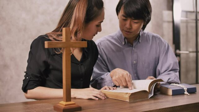 Young missionary is advising young woman in the church.