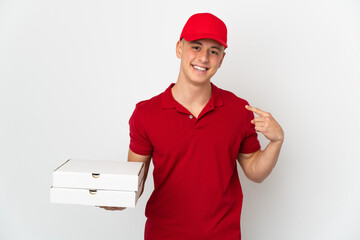 Pizza delivery man with work uniform picking up pizza boxes isolated on white background giving a...