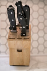 Kitchen knives in a knife holder on a counter