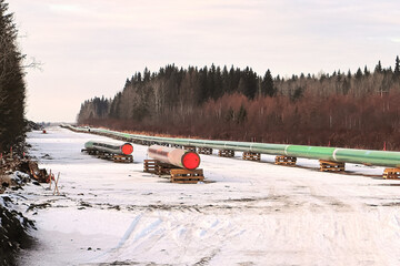 A long row of pipeline being pieced together