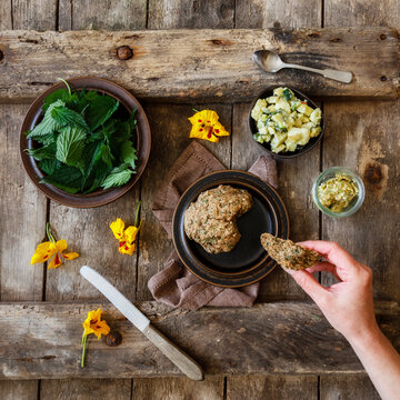 Potato salad, fresh nettle, herb butter and yellow flower heads