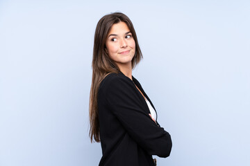 Young Brazilian business woman over isolated blue background laughing