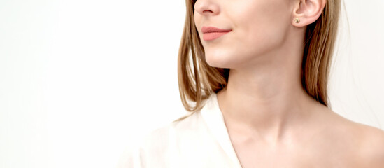 Half face portrait of a beautiful young caucasian woman on a white background with copy space