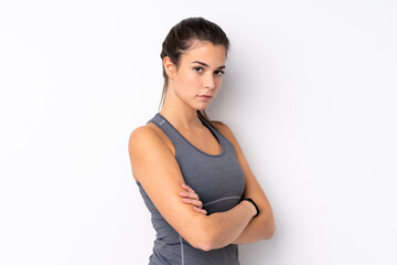 Teenager Brazilian sport girl over isolated white background keeping the arms crossed