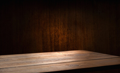 Selected focus empty brown wooden table and wall texture or old black brick wall blur background image. For your installation or product demonstration