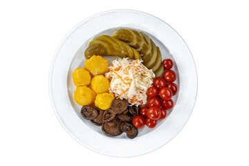 Pickles tomatoes, mushrooms, zucchini and cabbage on plate.
