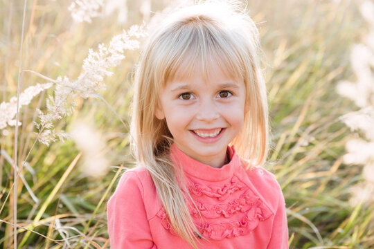 Smiling cute girl in agricultural field