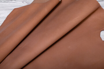 Rolls of natural beige cow leather