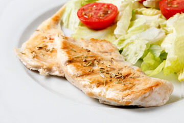 Grilled chiken with rosemary and salad of lettuce with cherry