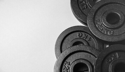 iron Dumbbell discs and dumbbell Fitness or bodybuilding concept background Product