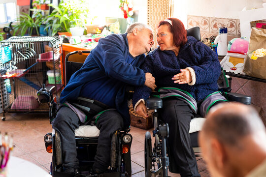 Disabled couple sitting in nursing home