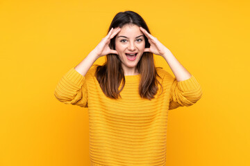 Young caucasian woman isolated on yellow background with surprise expression