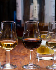 Tasting glass with strong alcoholic spirit drink whisky, cognac, armagnac or calvados