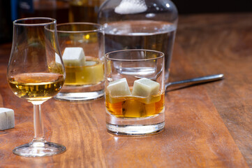 Tasting glass with strong alcoholic spirit drink whisky, cognac, armagnac or calvados