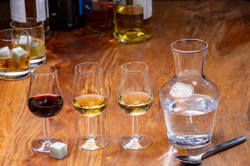 Tasting glass with strong alcoholic spirit drink whisky, cognac, armagnac or calvados