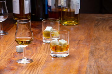 Tasting glass with strong alcoholic spirit drink whisky, cognac, armagnac or calvados