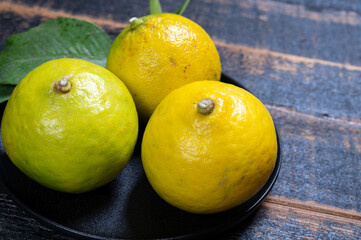Fresh ripe bergamot orange fruits, fragrant citrus used in earl grey tea, medicine and spa treatments