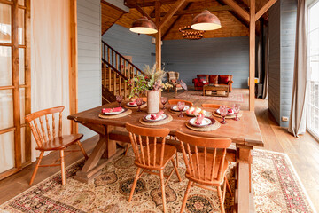 cozy all wooden interior of a country house in a wooden design. spacious living room with kitchen...