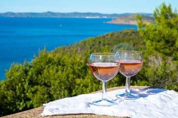 Picnic with of local rose wine and blue Mediterranean sea on background, near Saint-Tropez, Var, Provence, France