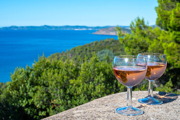 Picnic with of local rose wine and blue Mediterranean sea on background, near Saint-Tropez, Var, Provence, France