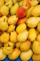 Delicious pears on market stand