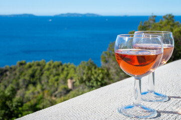 Picnic with of local rose wine and blue Mediterranean sea on background, near Saint-Tropez, Var, Provence, France