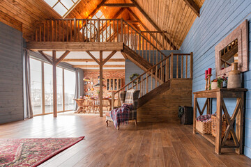 cozy all wooden interior of a country house in a wooden design. spacious living room with kitchen...