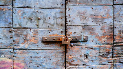 Colorful wooden door from an european country. Old, picturesque and ancient door.