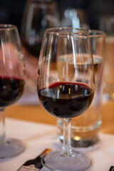 Professional tasting of different fortified dessert ruby, tawny port wines in glasses in porto cellars in Vila Nova de Gaia, Portugal